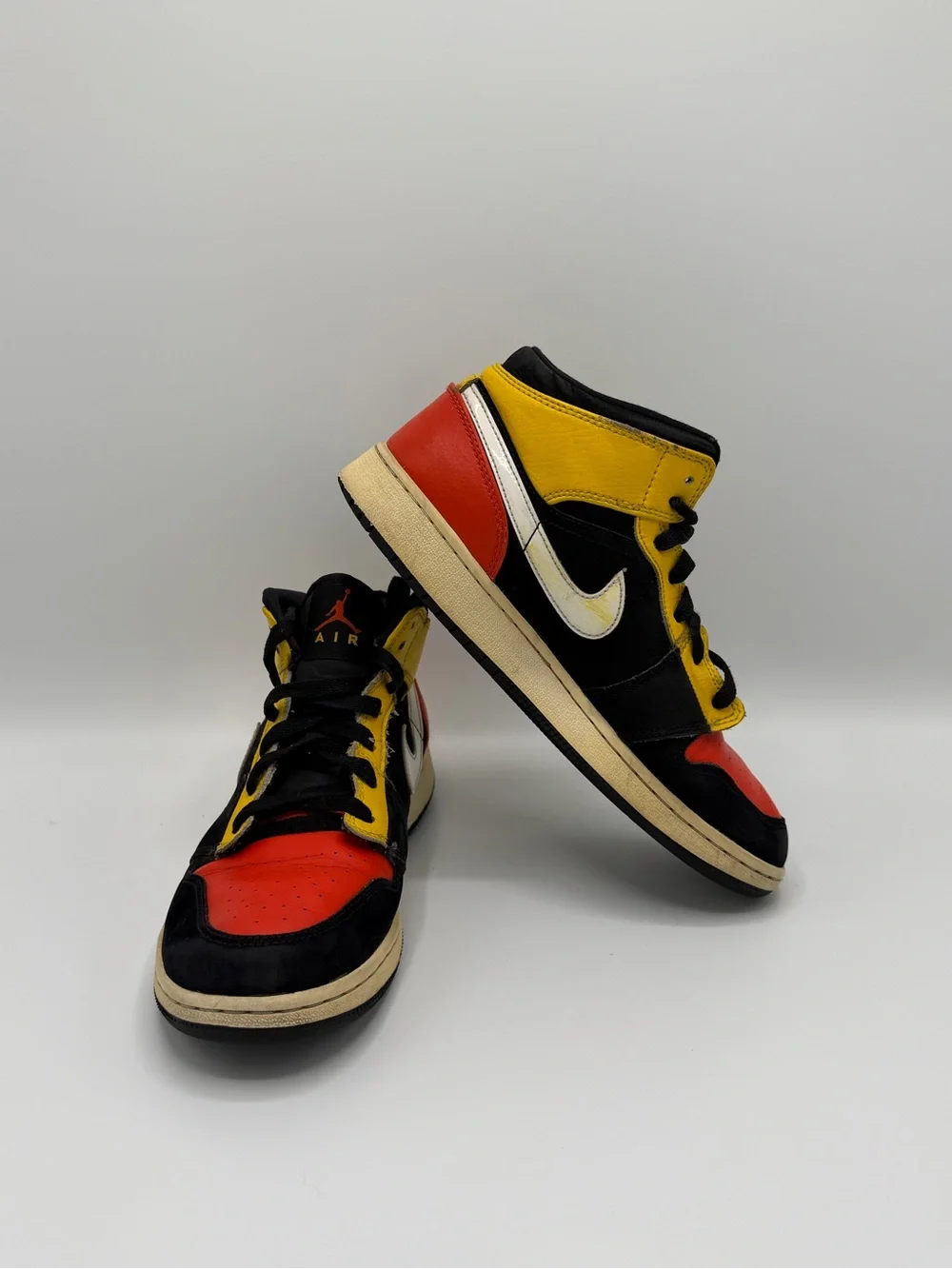 Jordan High-Top Sneakers in Black, Red & Yellow